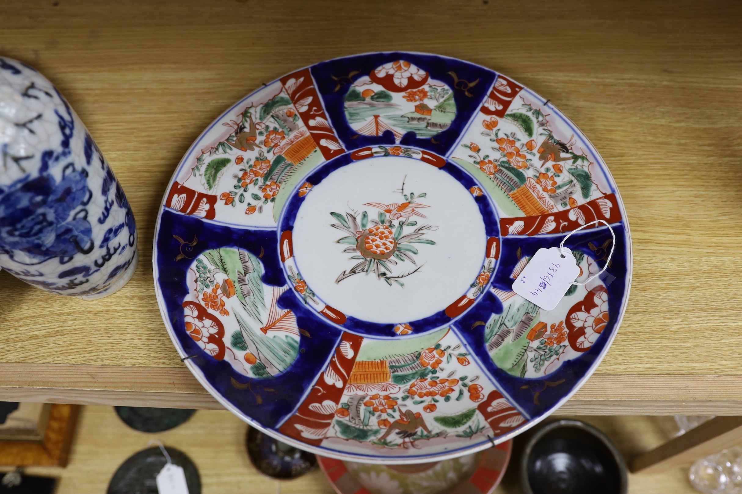 A Chinese two handled crackle glaze vase, Kangxi mark, but late 19th century, together two Imari plates, 37cm diameter